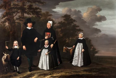 En Enkhuizen-familiegruppe med to geder i et træbevokset landskab
