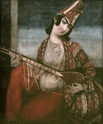 Ung kvinde spiller guitar