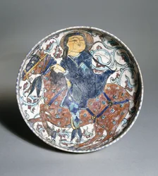 En mina"i skål forestillende en ridende rytter omgivet af et blomstermotiv, ca. 1200