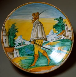 Ung bevæbnet mand. Keramisk fad fremstillet i Viterbo, Italien. Slutningen af det 16. århundrede. Firenze, Museo Nazionale del Bargello