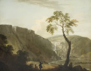 Et klippelandskab med et vandfald og en kunstner i forgrunden