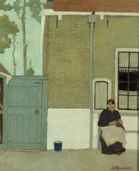 Kvinde foran sit hus