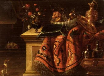Et stilleben med en vase med blomster, frugt i en skål, en sølvforgyldt æske og tallerken og en pude