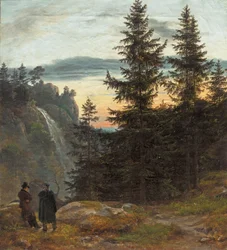 To mænd foran et vandfald ved solnedgang