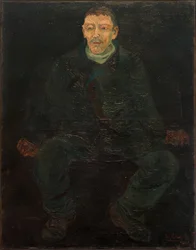 Siddende mand i blåt jakkesæt