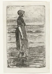 Stående kvinde på stranden