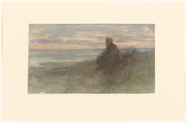Kvinde sidder på en klit ved havet