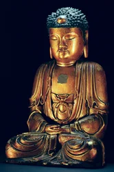 En figur af den siddende Buddha (guld lak)