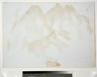 Bjerglandskab med bygninger i forgrunden