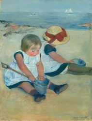 Børn, der leger på stranden