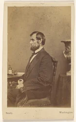 [Abraham Lincoln siddende, i profil]
