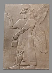Reliefpanel med vinget overnaturlig figur med ørnehoved, ca. 883-59 f.Kr.