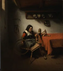 Gammel kvinde, der spinder
