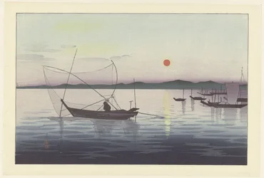 Kalastusveneet auringonlaskun aikaan