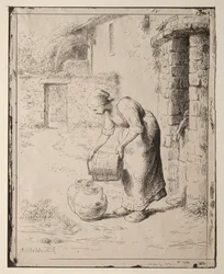 En kvinde tømmer en spand