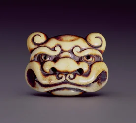 Netsuke skildrer ansigtet af en oni-dæmon, ca. 1870 (hjort-gevir)