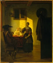 Et par, der spiller kort, med en tjenestepige
