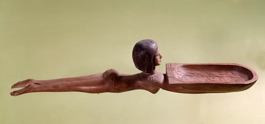 Egyptisk oldtid: Træske til kosmetik i form af en nøgen svømmerinde, der holder en and. 18. dynasti, Det Nye Rige. Paris, Louvre-museet