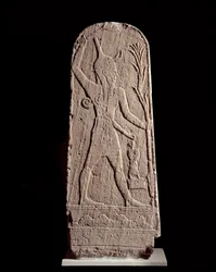 Orientalsk kunst: stele af guden Baal i lynet. (Krigergud, der beskytter kongen) Skulptur fra det 15. århundrede f.Kr., Syrien. Paris, Musée du Louvre