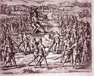 Inkakongen Atahualpa (eller Atabaliba), der holder et scepter formet som en sol, bæres i en bærestol for at møde Francisco Pizarro