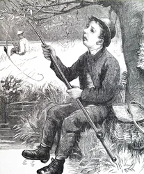 En ung dreng, der fisker