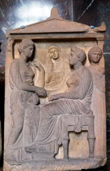 Gammelt græsk relief, der viser venner, der hilser på hinanden
