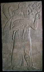 Assyrisk relief af en bevinget figur, 9. århundrede f.Kr
