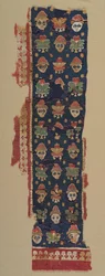 Border of Heads and Palmettes from a Large Hanging, 500s.
