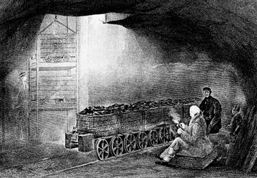 Bunden af en grubeskakt i en kulmine med et tog af læssede vogne, 1860