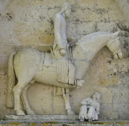 Detalje af sideportalen, der repræsenterer kejser Konstantin I den store, der symboliserer det kristne fortrængende hedenskab, Saint Hilaire-kirken i Melle (79500), Deux Sevres