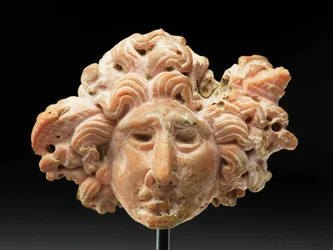 Head of Medusa, from Bactria or Gandhara, 2nd-1st century BC (pink coral)
