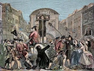 Daniel Defoe (De Foe) (1659-1731) søgte i London i 1703 for at have udgivet sin ironiske traktat "" The Shortest Way With the Dissenters""" - Forfatteren og eventyreren Daniel Defoe (1659-1731) dømte i 1703 til pillen. for hans manuskripter mod int