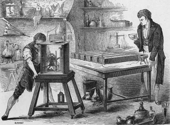 Humphry Davy nedbryder alkalierne ved hjælp af det elektriske batteri. I "Album de la Science", Éditions Jouvet