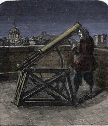 Isaac Newton (1642-1727) engelsk fysiker, der bruger sit teleskop.