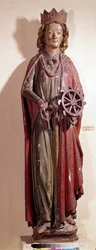 Repræsentation af den hellige Katarina af Alexandria, der holder hjulet instrument af hendes pine. Polykrom træstatue