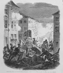 Revolutionen i marts 1848: barrikade i Berlin den 19/03/1848. Frederik Vilhelm IV af Preussen vil blive ført til at acceptere genforening og en liberal regering.