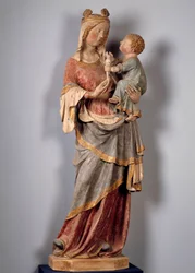 Jomfru og barn Barnet holder duen. Polykrom stenskulptur fra begyndelsen af 1300-tallet. Champeuil, sognekirke
