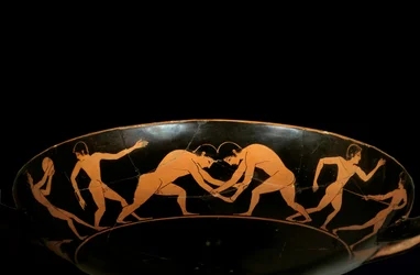 Loftskop med røde figurer, der repræsenterer atleter under træning, en diskobol og brydere. Maleri tilskrevet Euergides-maleren (slutningen af det 6. århundrede f.Kr.). Paris, Louvre-museet